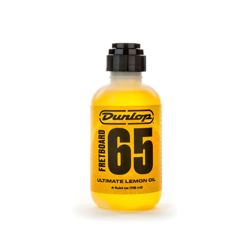 Frasco de Aceite de Limón Jim Dunlop 6554 Formula 65 de 4oz con aplicador para limpieza y acondicionamiento de diapasones de madera oscura.